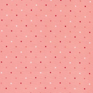 May include: A pink fabric with a repeating pattern of white, red, and light pink polka dots.
