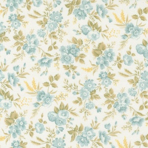 May include: A white fabric with a repeating pattern of blue flowers and yellow sprigs. The floral pattern is delicate and feminine.