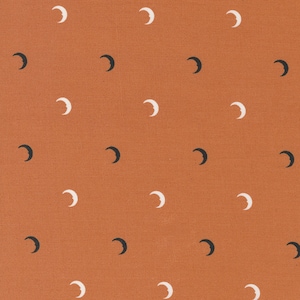 May include: A seamless pattern of white and black crescent moons on a burnt orange background.