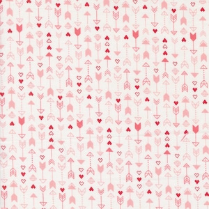 May include: White fabric with a repeating pattern of pink and red arrows and hearts.
