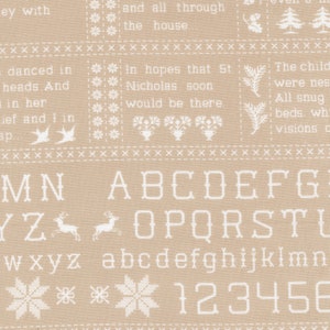 May include: A beige fabric with a white pattern of snowflakes, reindeer, and the alphabet. The text "In hopes that St. Nicholas soon would be there." is also included in the pattern.