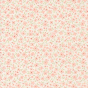 May include: A white fabric with a repeating pattern of small pink flowers and green leaves.