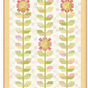 May include: A floral quilt featuring three stylized flowers with green stems and leaves. The flowers have red and orange petals with yellow centers. The quilt has a white background with a yellow border.