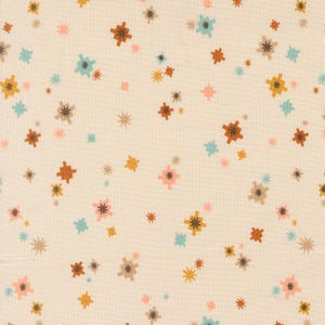 May include: Off-white fabric with a repeating pattern of colorful starburst and star shapes. The starbursts are in shades of brown, yellow, teal, pink, and gray. The smaller stars are in matching colors. This fabric is suitable for quilting and crafting projects.
