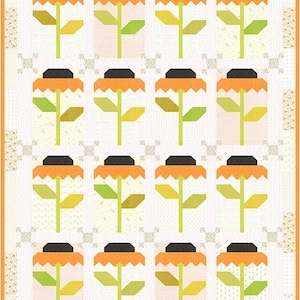 May include: A quilt pattern featuring a repeating design of orange, yellow, and green stylized flowers with black centers on a white background with a light orange border.