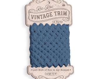 May include: A spool of blue ric-rac vintage trim measuring 12 yards and 5/8 inches wide. The packaging features the text Ric-Rac VINTAGE TRIM, 12 Yards, Lori Holt of Bee in my Bonnet, and Large 5/8 inch, with a small bee illustration.