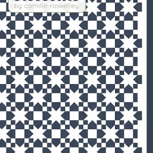 May include: A quilt pattern featuring a repeating geometric star design in navy blue and white. The pattern is labeled "thimble blossoms" by Camille Roskelley. The quilt is a two-color design, measuring 60" x 80".