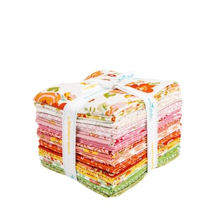May include: A stack of colorful fabric squares tied with a white ribbon. The fabric features floral patterns in shades of orange, pink, yellow, and green. The ribbon has the text "create colorfully" printed on it.