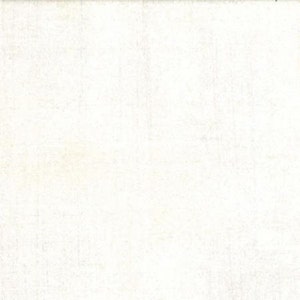 May include: Off-white fabric with a subtle, textured weave. The material appears to be a light, neutral color, suitable for various crafting or design projects. The surface has a slightly aged or vintage appearance.
