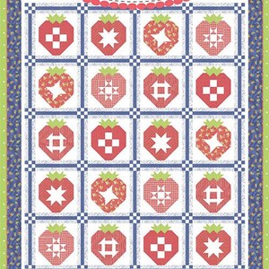 May include: A quilt with a repeating strawberry pattern. Each strawberry is red with a green stem and leaf. The quilt has a white background with blue and green borders. The text "Coriander Quilts" and "#239 Strawberry Sampler" are visible.