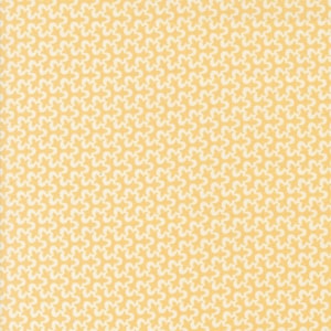 May include: A yellow fabric with a white repeating pattern of small stylized flowers.