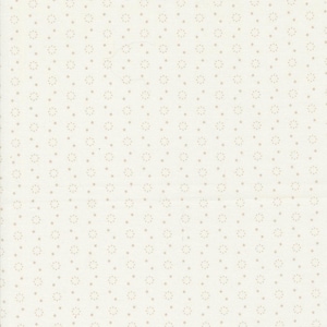 May include: Cream-colored fabric with a repeating pattern of small, light brown dots and floral-like designs. The fabric has a subtle texture, and the pattern is evenly spaced across the surface. This textile is suitable for various craft projects.