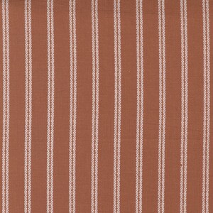 May include: A close-up of a fabric with a brown background and white vertical stripes. The fabric has a subtle texture.