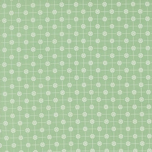 May include: A green fabric with a white floral pattern. The pattern is a repeating design of small white flowers with a cross in the center.