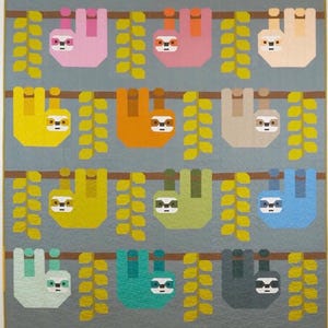 May include: A colorful quilt featuring a repeating pattern of sloths hanging from branches. The sloths are in various colors, including pink, orange, yellow, and blue, with white and black facial details. The background is a light gray, and the branches and leaves are brown and yellow.