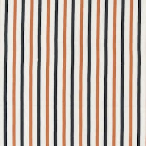 May include: A fabric with a repeating vertical stripe pattern. The stripes alternate between white, black, and a muted orange-brown color. The fabric has a slightly textured appearance, suggesting a woven material.