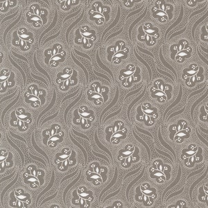 May include: A seamless pattern featuring a repeating design of white stylized leaves on a brown background. The leaves are arranged in a symmetrical pattern and are surrounded by small white dots.