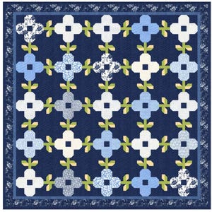 May include: A blue and white quilt with a floral pattern. The quilt is made up of squares with a white center and blue corners. The squares are arranged in a grid pattern. The quilt is edged with a blue and white border.