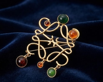 Vintage gouden broche, Loewe-stijl speld met kristallen edelsteen, retro luxe sieraad, elegante statement broche, Europees modecadeau