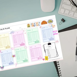 May include: A colorful weekly planner with the title "HAFTALIK PLAN" in Turkish. The planner features sections for daily tasks, with pastel-colored boxes and decorative stickers. A notebook, pen, and keyboard are also visible.