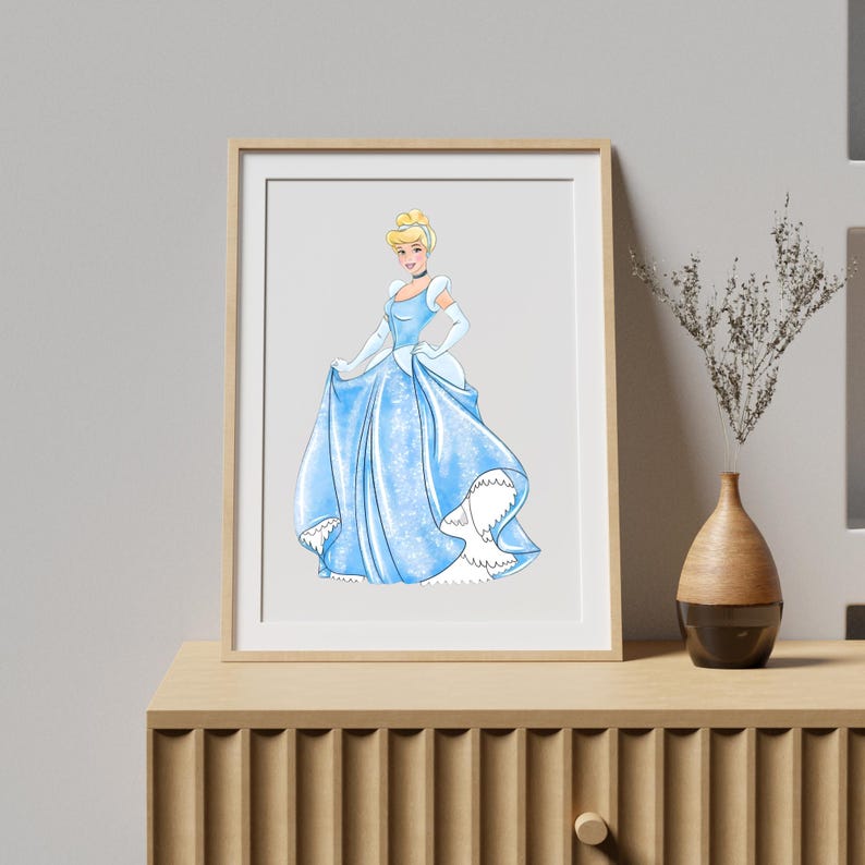 May include: A framed print featuring a watercolor illustration of a woman in a light blue ball gown. The artwork depicts a blonde woman with a choker and white gloves. The dress has a ruffled hemline and is set against a light gray background.