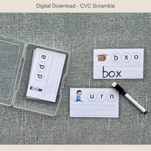 May include: A clear plastic case containing flashcards with letters and illustrations. Two additional cards show the words "box" and "urn" with corresponding images. A black and white dry-erase marker is also present. The text "Digital Download - CVC Scramble" is at the top.