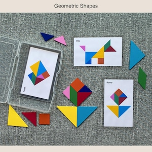 May include: A set of colorful wooden geometric shapes and cards. The cards feature illustrations of a heart, dog, and flower made from the shapes. The set includes triangles, squares, and diamonds in various colors, and is labeled "Geometric Shapes".
