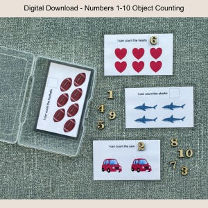 May include: Educational digital download featuring counting cards with footballs, hearts, sharks, and cars. Includes wooden numbers 1-10. The cards are designed to help children learn to count objects. The image is on a gray background.