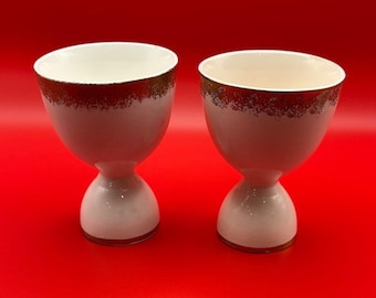 VTG Set van 2 porseleinen eierdopjes ivoor met gouden rand rond boven- en onderkant