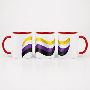 May include: Three white ceramic mugs with bright red handles and interiors. Each mug features a horizontal wavy graphic design consisting of yellow, white, purple, and black stripes, representing the non-binary pride flag colors.