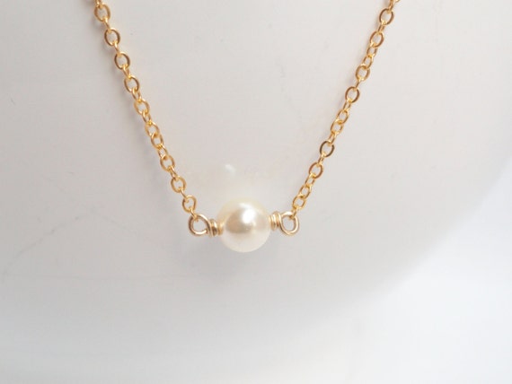 Solitaire floating pearl best sale necklace