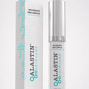 May include: A white rectangular box and a cylindrical bottle of Alastin Skincare Restorative Skin Complex with TriHex Technology. Both items feature teal molecular patterns, silver caps, and the text 1.0 Fl. Oz. 29.6 mL printed on the front.