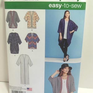 May include: Simplicity sewing pattern 1108, featuring various cardigan designs. The pattern includes sizes XXS-XXL. The cover displays images of the finished garments and the text "easy-to-sew".