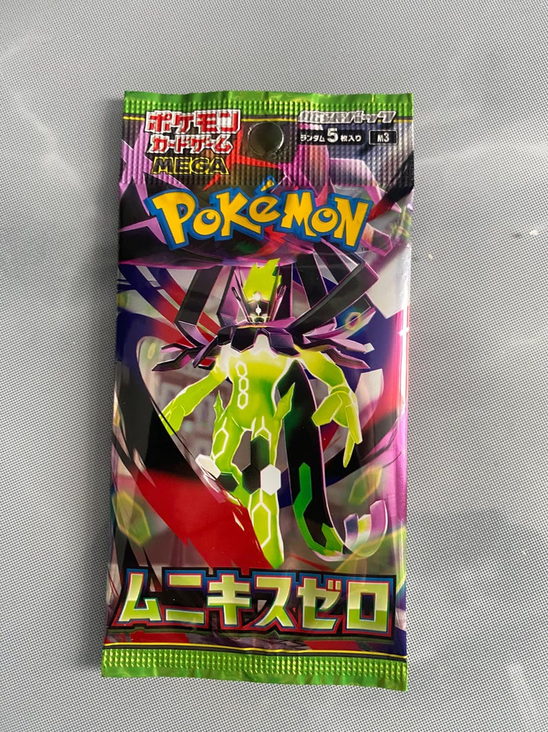 May include: A sealed Pok&eacute;mon card pack with a vibrant design. The pack features the Pok&eacute;mon logo and a green and black character illustration. Text in Japanese is visible. The packaging has a mix of pink, purple, and green colors.