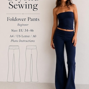 May include: A sewing pattern for foldover pants labeled Beyond Sewing, featuring sizes EU 34-46, A4, US Letter, and A0 formats with photo instructions. The image displays a navy blue strapless top and matching navy blue foldover flare pants.
