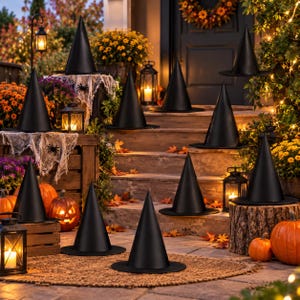 May include: A collection of eleven black pointed witch hats arranged on a porch decorated with pumpkins, lanterns, and autumn flowers. The hats feature a wide brim and a tall, conical crown, displayed on various levels of the steps and wooden crates.