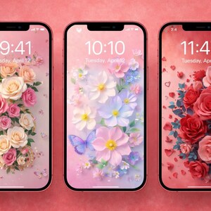 Pode incluir: Três smartphones exibindo designs de papel de parede floral. As telas mostram uma variedade de flores, incluindo rosas e margaridas, em tons de rosa, branco e roxo. A hora e a data são exibidas em cada tela.