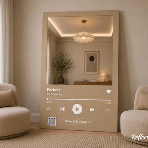 May include: A large, beige-colored mirror with a Spotify-style design, featuring the song "Perfect" by Ed Sheeran. The mirror has a rectangular frame and includes a play button, song progress bar, and the words "forever & always".