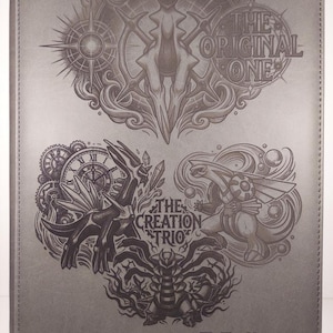 May include: Gray Z-Folio binder with embossed artwork. The design features intricate illustrations of creatures and text that reads "THE ORIGINAL ONE" and "THE CREATION TRIO". The binder is a solid gray color.