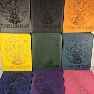 May include: A collection of nine colorful card binders. Each binder features a debossed design of various Eevee evolutions and the text "EEVEELUTIONS Z-Folio". The binders are in various colors, including black, gray, orange, yellow, green, blue, purple, and pink.