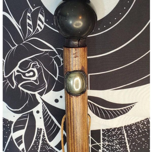 Shungite Orb Wizard Staff, 56" tall featuring a carved twist, 52mm Shungite Orb, and Pyrite Cabochon. Includes lanyard and Velvet bag shown