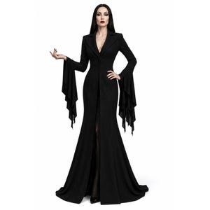 May include: A floor-length black dress featuring a structured blazer-style bodice with a notched lapel, long sleeves with dramatic flared and layered cuffs, and a fitted waist that transitions into a full-length skirt with a central front slit.