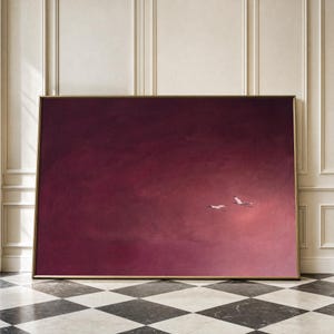 May include: A large rectangular wall art piece featuring a deep burgundy and dark red gradient background. Two small white birds are depicted in flight towards the right side of the frame, set against the expansive, solid-coloured sky-like canvas.