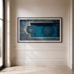 May include: A rectangular wall art print in a black frame featuring a high-angle view of a swimming pool with intricate blue and white mosaic tile patterns on the floor and walls, showcasing a large circular medallion design in the centre.