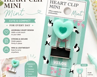 May include: A mint green heart-shaped binder clip with a black metal base, mounted on a striped card featuring rabbit illustrations and the text Heart Clip Mini. The clip measures 1.57 inches in height and 0.79 inches in width as shown on the card.