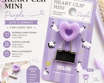 May include: A purple heart-shaped binder clip on a purple striped backing card with cat illustrations. The packaging features the text HEART CLIP MINI and VELOS. A size diagram shows the clip measures 4 cm by 2 cm, or 1.57 inches by 0.79 inches.