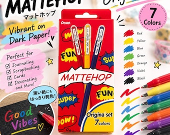 May include: A Pentel Mattehop original set of 7 gel pens in red, yellow, blue, green, orange, violet, and black. The rectangular red packaging features the brand name, comic-style graphics, and text indicating the pens have smooth matte ink.