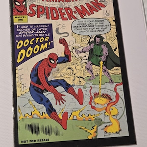 May include: A vintage Spider-Man comic book, volume 10, with Spider-Man and Doctor Doom on the cover. The comic book cover has the text "The Amazing Spider-Man" and "Doctor Doom". The comic is marked "Not for Resale".