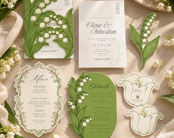May include: A wedding stationery set featuring white and green lily of the valley illustrations. The collection includes a rectangular invitation, a menu card with ornate borders, a details card, a name tag, and two flower-shaped RSVP cards.