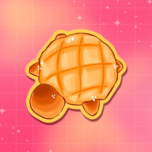 May include: A digital illustration of a cartoon turtle-shaped pastry. The pastry is a golden-brown color with a grid pattern on its back, and a smaller, rounder piece at the bottom. The background is pink with white stars.